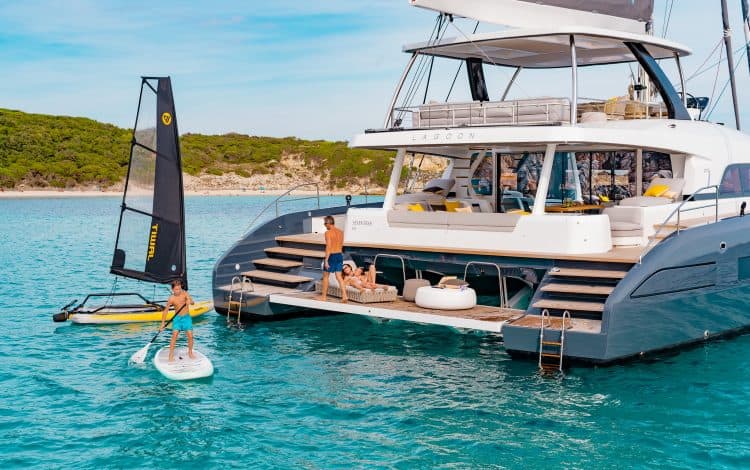 family enjoying water sports of the stern of a Lagoon Seventy7