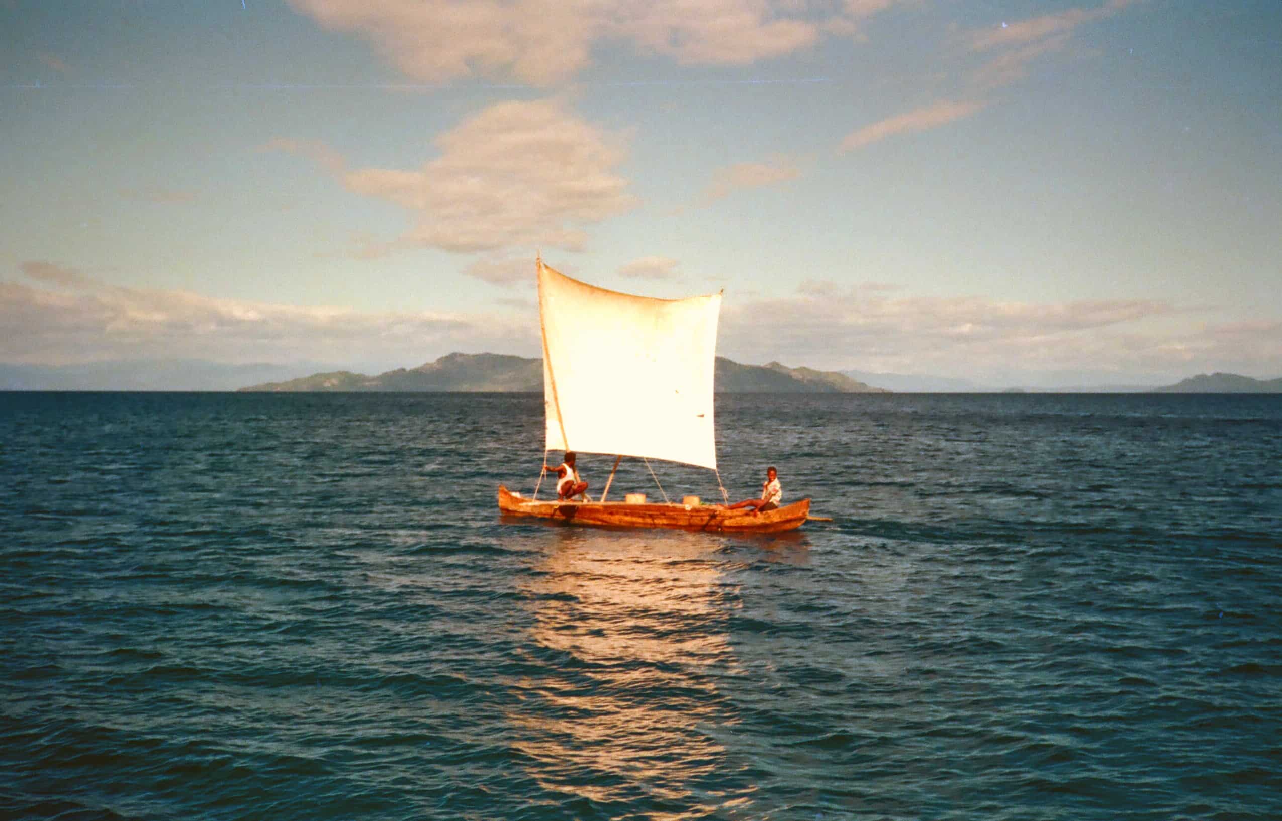 Locals sailing their pirogue across the channel from Hellville to Nosi Komba
