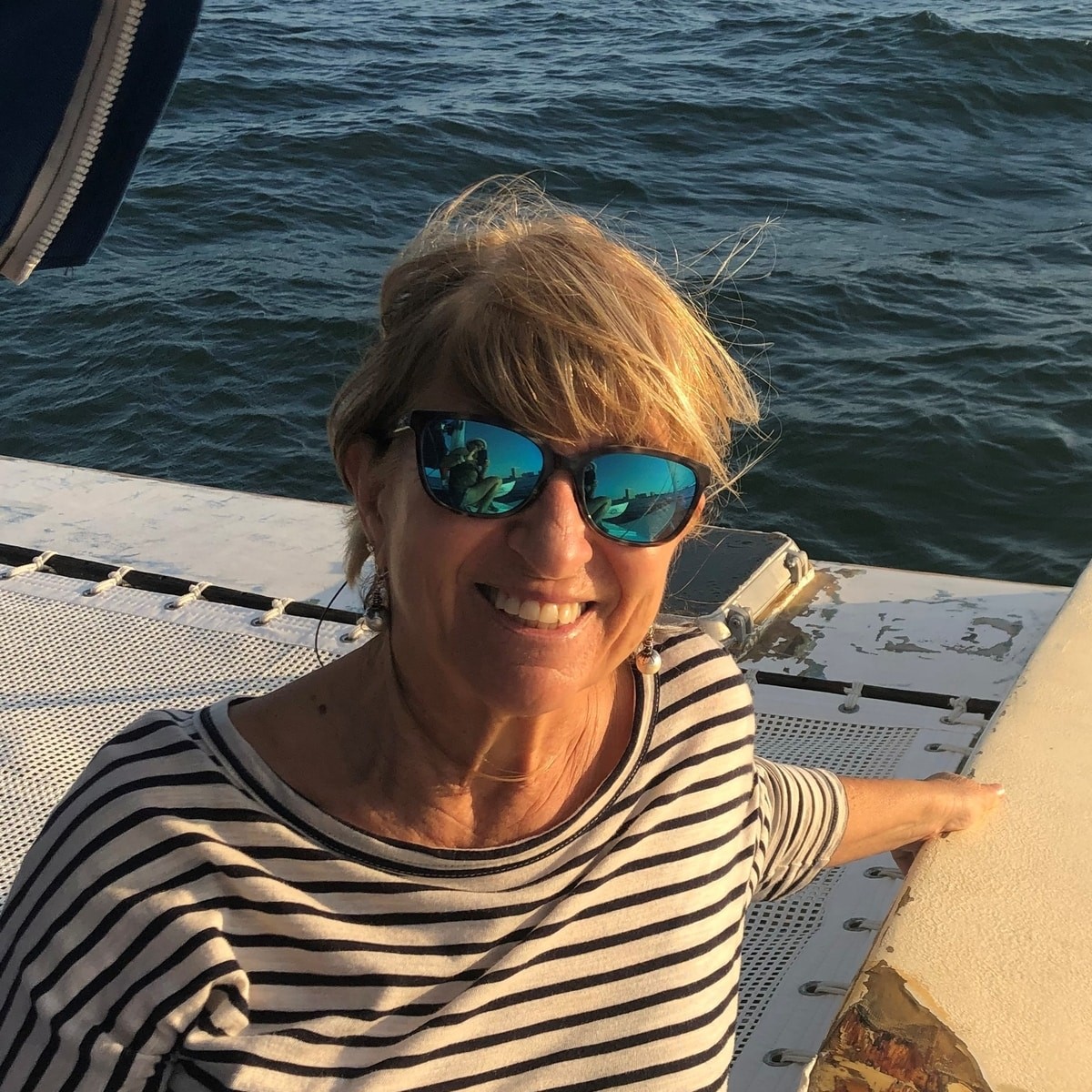 christine buttigieg in sunglasses aboard her yacht