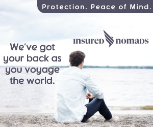 image of a guy sitting on a beach representing he is a sailor who is covered by insured nomads travel and medical insurance while on voyage