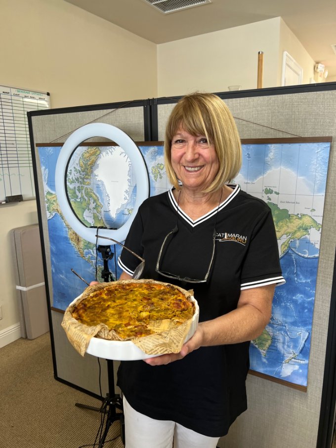 catamaran guru broker christine shows off her leek and pancetta quiche