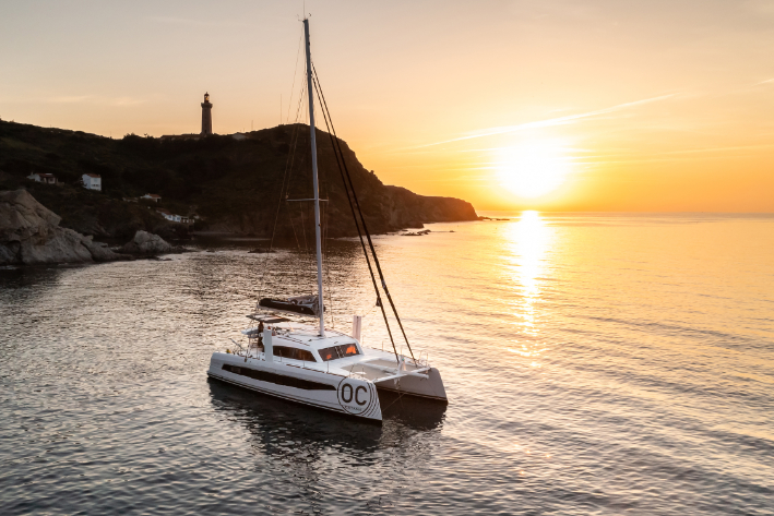 catana ocean class 50 anchored at sunset