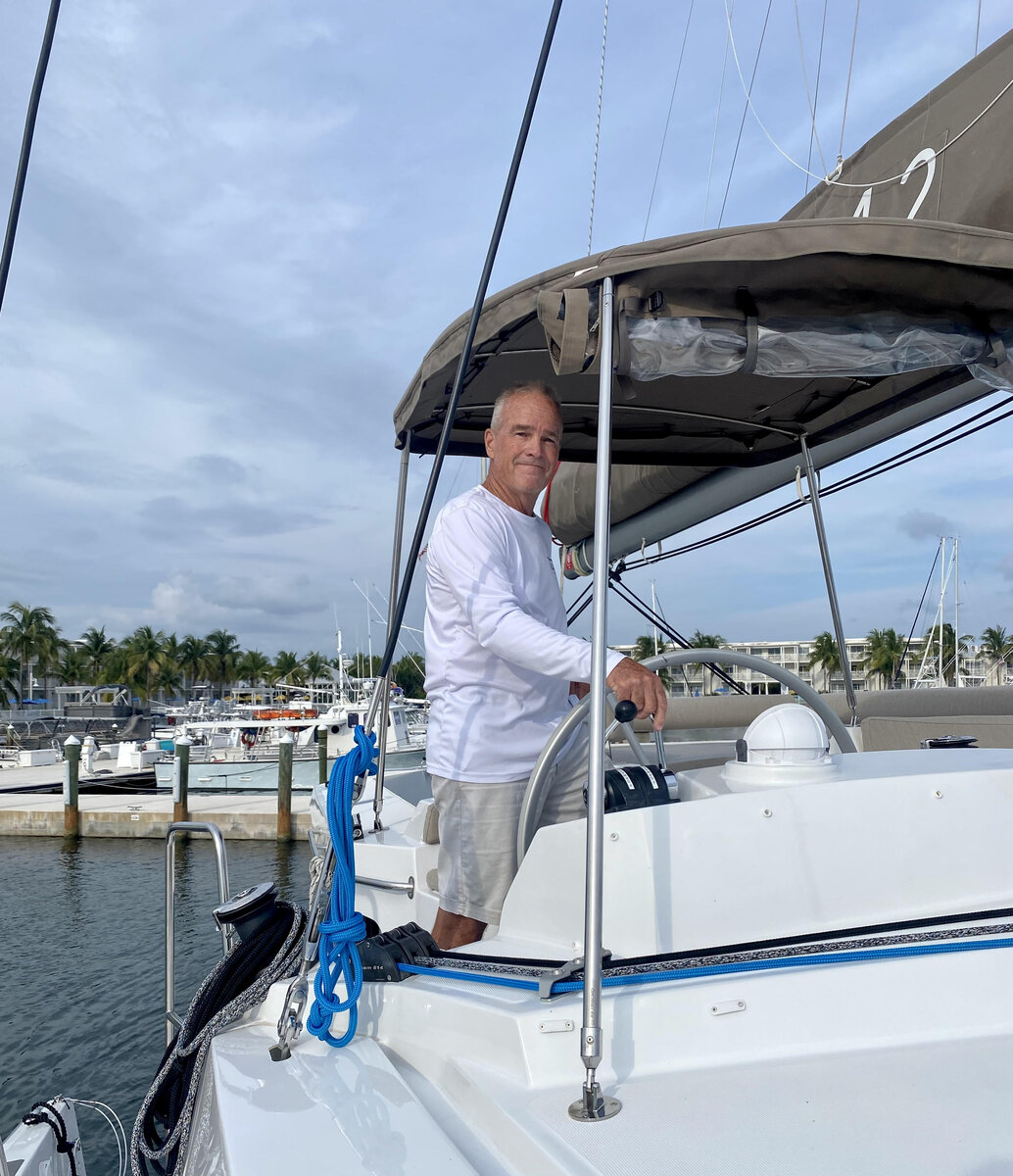 capt dave wiley yacht broker at helm of his 2023 bali 4.2 the tamboo